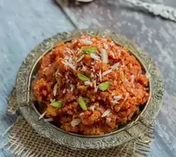 Saffron_Carrot_Halwa_with_Pistachios_Sweet_Treat_Delicious_Dessert_Saffron_Infused_Flavor_Carrot_Halwa_Aromatic_Delight_Nutritious_Snack_Natural_Ingredients_Wholesome_Cooking_Rich_Texture_Satisfying_Bite_Homemade_Ayurvedic_Delicacy_Pistachio_Crunch_Nourishing_Treat_Ayurvedic_Food_Ayurveda